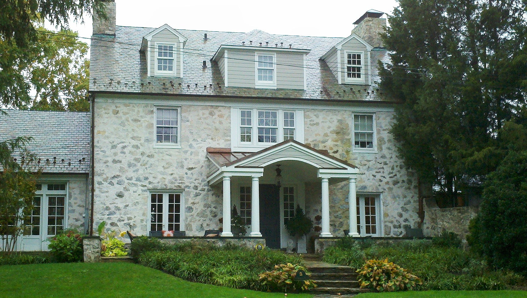 New Exterior Portico and Dormer Trim and Siding